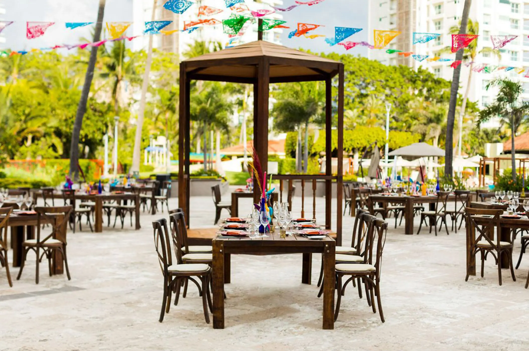 Plaza wedding reception setup with colorful banners at Marriott Puerto Vallarta, Puerto Vallarta