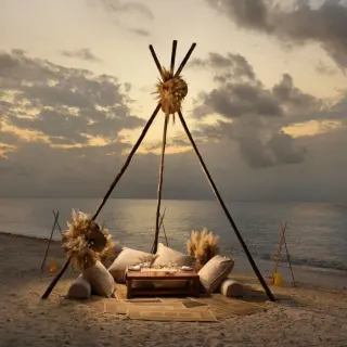 Boho beach dinner setup under a wooden teepee at Melia Cozumel, Cozumel