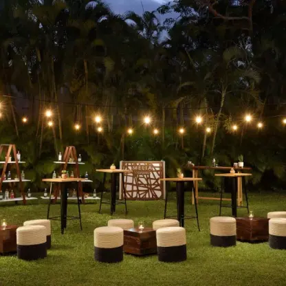 Iguana Garden Terrace evening wedding reception with string lights at Melia Cozumel