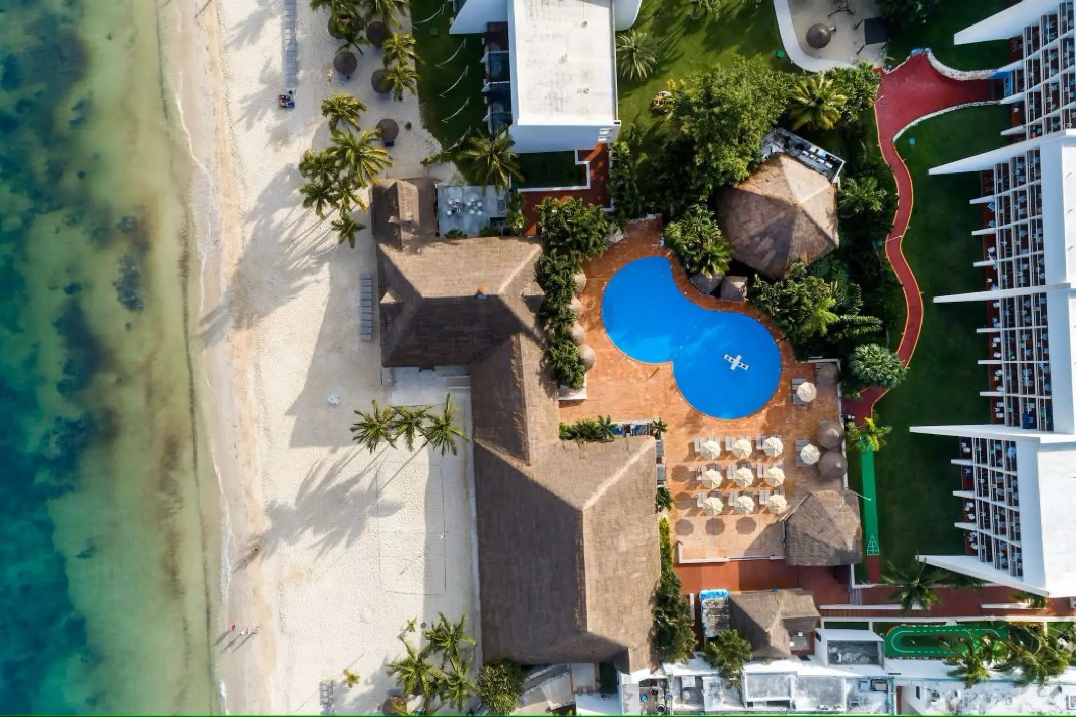 Aerial view of the swimming pools and beachfront at Melia Cozumel, Cozumel