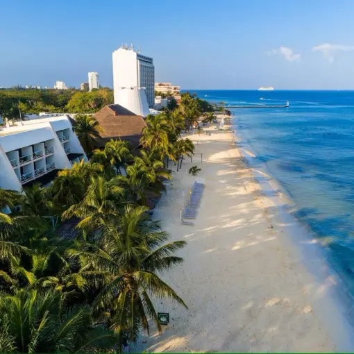 Aerial view of Melia Cozumel beachfront buildings and white sand beach, Cozumel