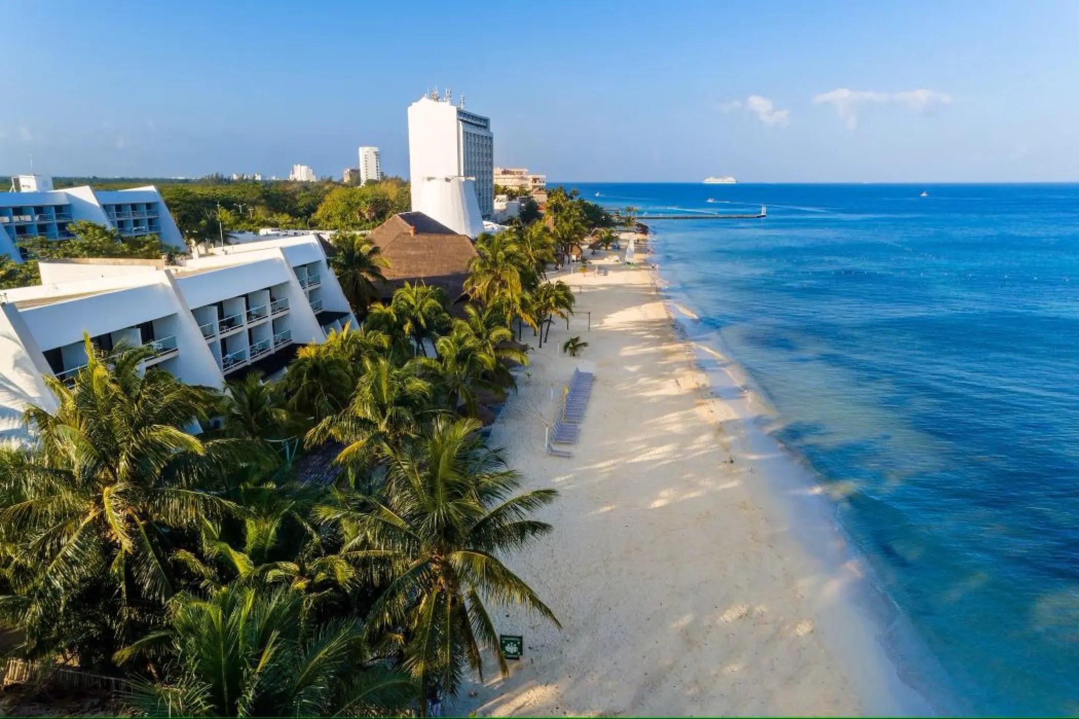 Aerial view of Melia Cozumel beachfront buildings and white sand beach, Cozumel