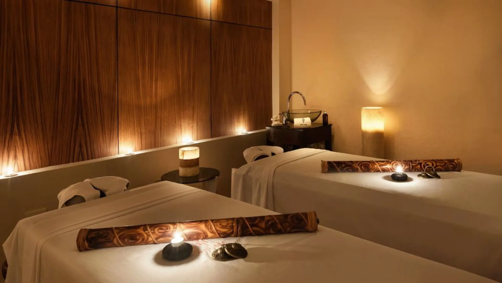 Couples massage treatment room with candles at Melia Cozumel, Cozumel