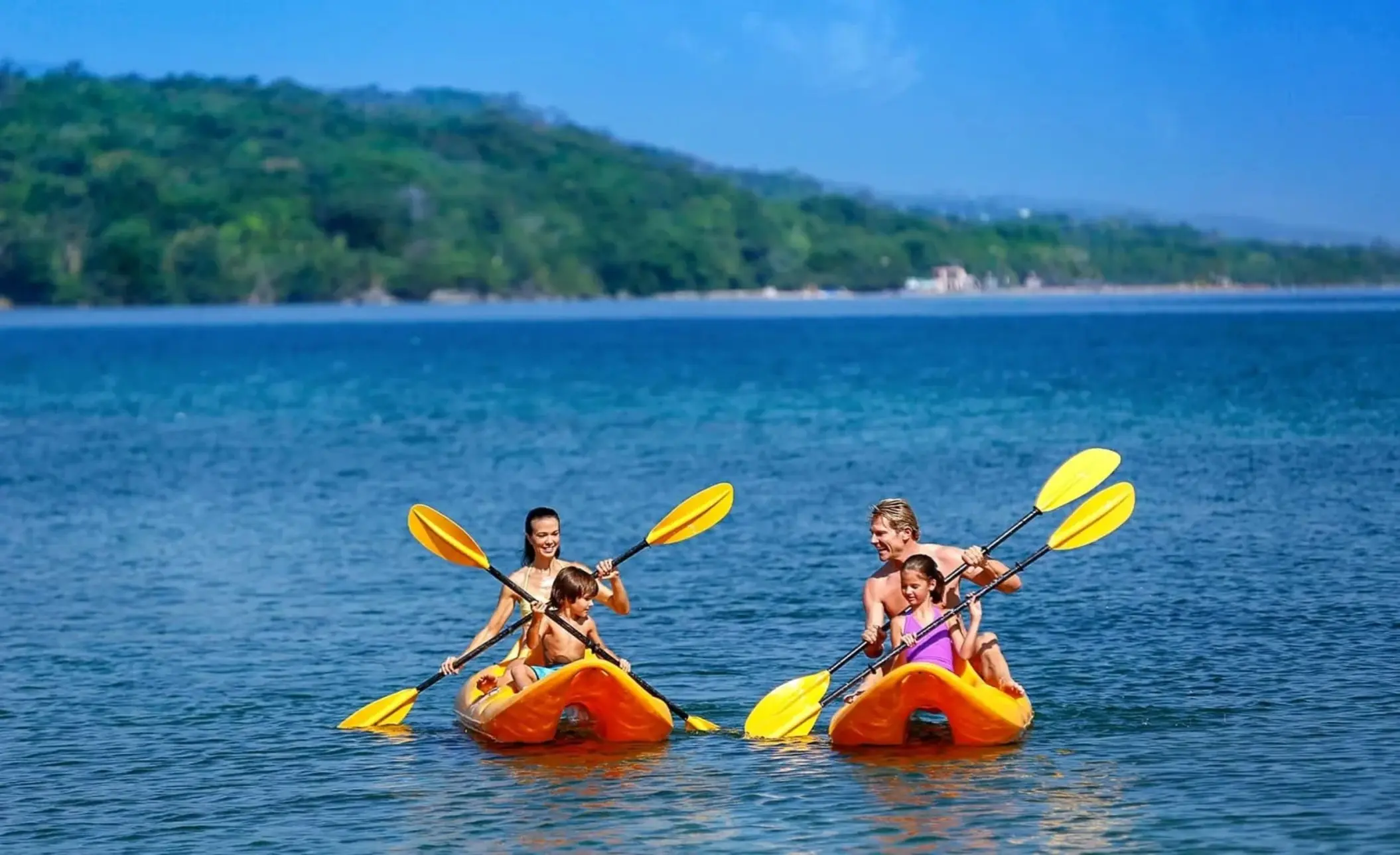 Family kayaking in the ocean at Moon Palace Jamaica, Ocho Rios