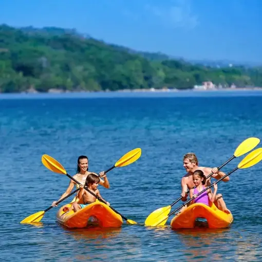 Family kayaking in the ocean at Moon Palace Jamaica, Ocho Rios