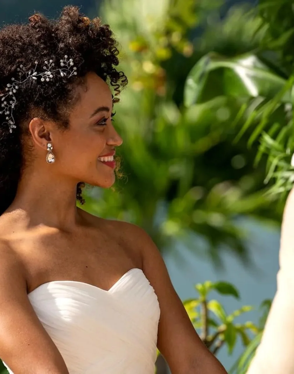 bride smiling while holding the groom's hand at Moon Palace Jamaica