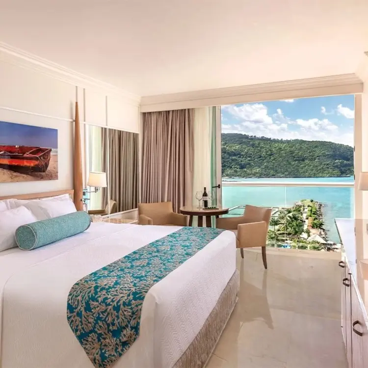 Deluxe ocean view suite with balcony overlooking the bay at Moon Palace Jamaica, Ocho Rios
