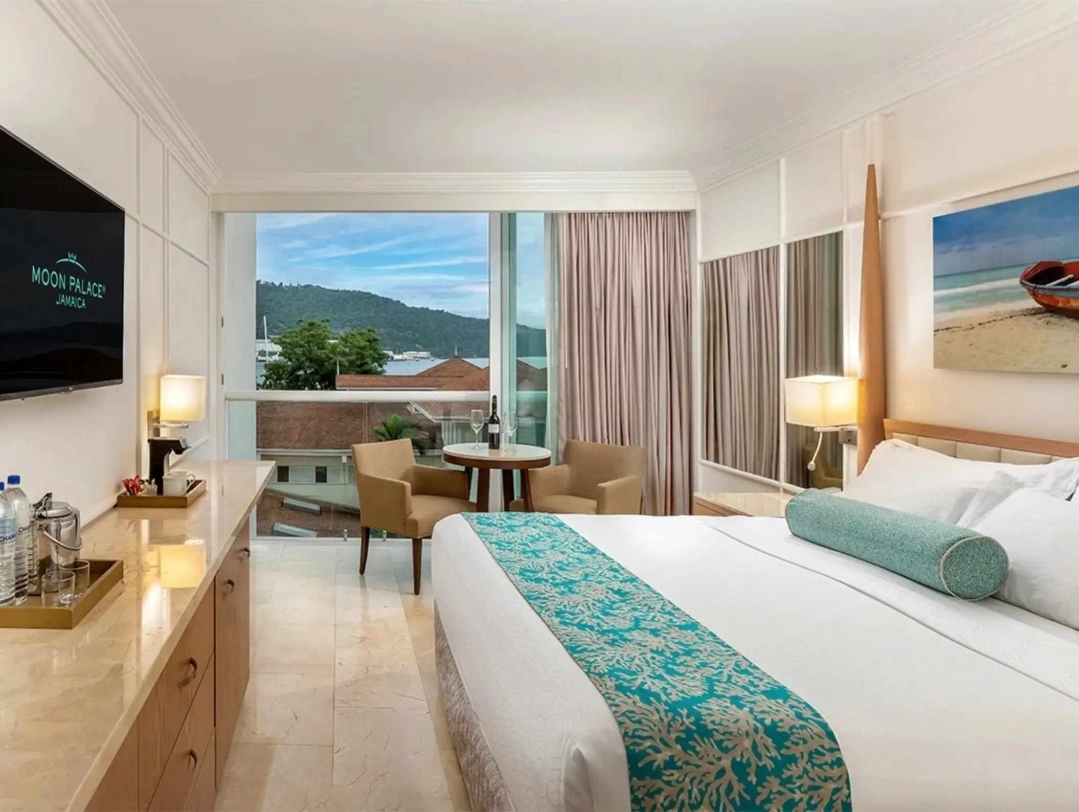 Deluxe room with resort views, seating area, and king bed at Moon Palace Jamaica, Ocho Rios