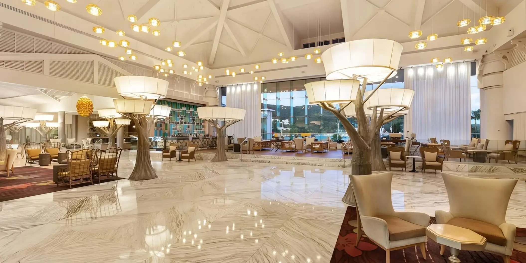 Modern lobby with marble floors and tree-inspired light fixtures at Moon Palace Jamaica, Ocho Rios