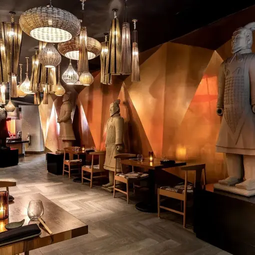 Momo Asian restaurant dining room with terracotta warrior statues at Moon Palace Jamaica, Ocho Rios