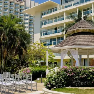 Terrazza Sur wedding ceremony setup with white chairs and a garden gazebo at Moon Palace Jamaica, Ocho Rios