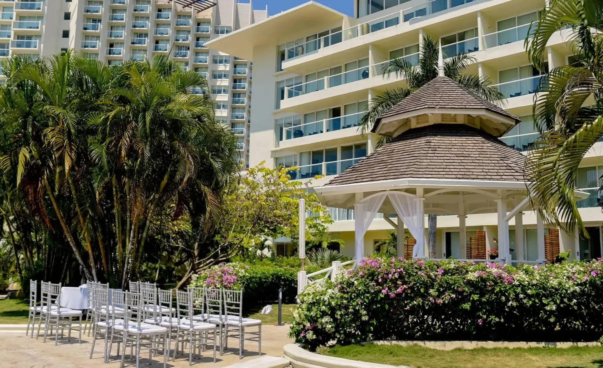 Terrazza Sur wedding ceremony setup with white chairs and a garden gazebo at Moon Palace Jamaica, Ocho Rios
