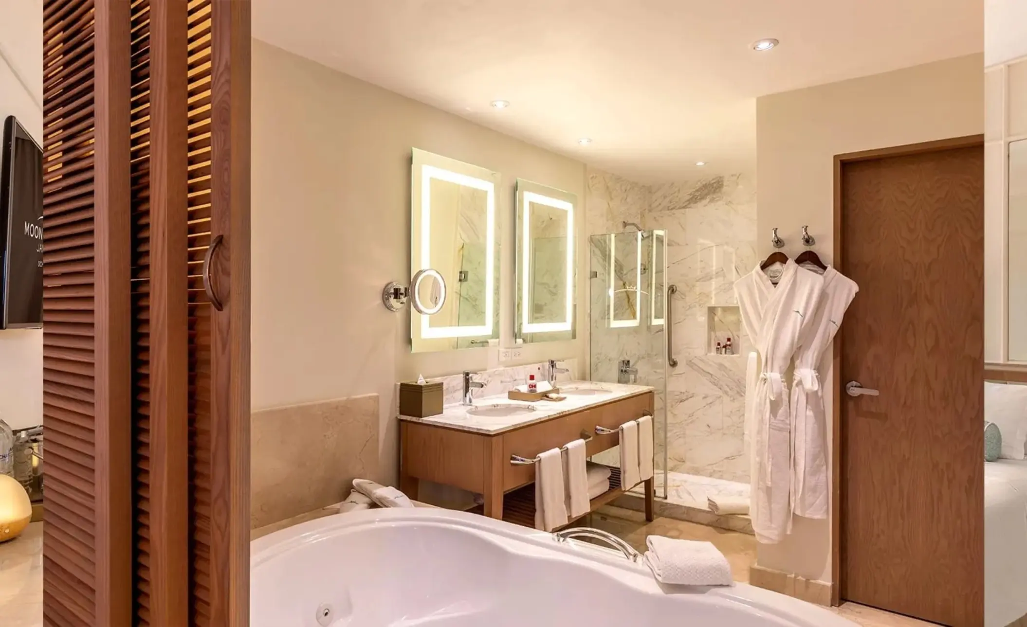 Modern suite washroom with a double vanity and soaking tub at Moon Palace Jamaica, Ocho Rios