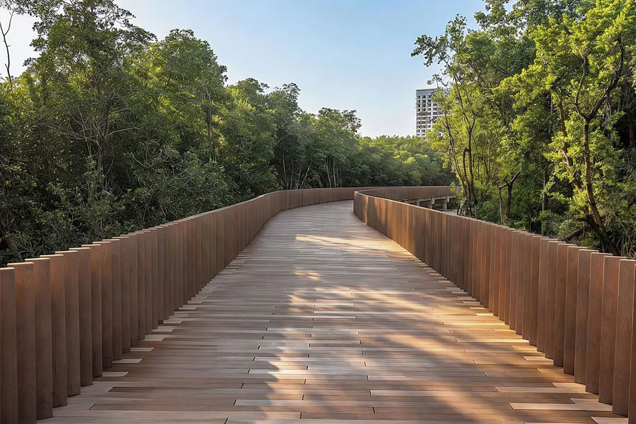 Wooden boardwalk winding through garden trees at Moon Palace Punta Cana
