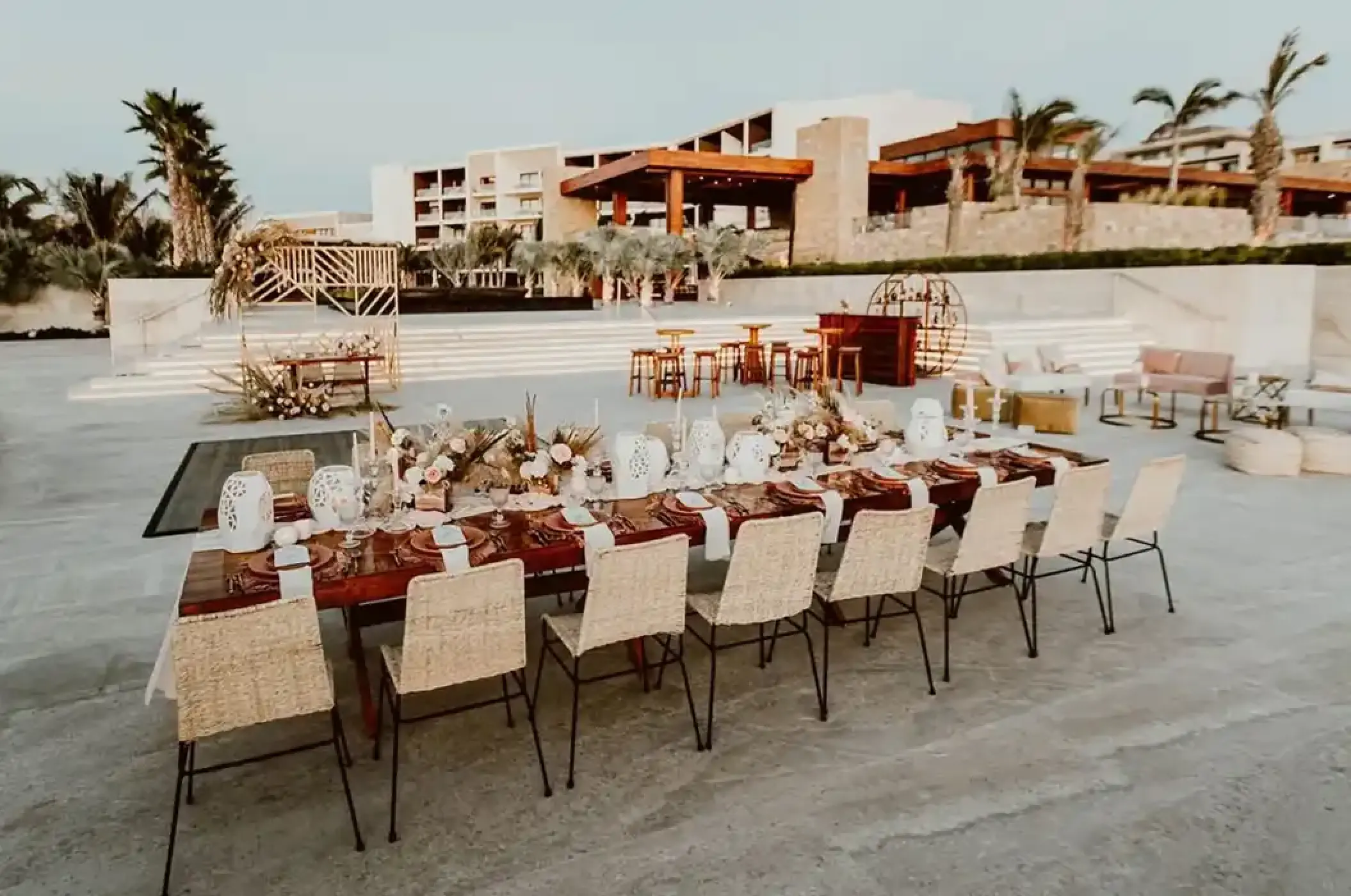 Outdoor wedding reception dinner setup on the terrace at Nobu Los Cabos, Cabo San Lucas