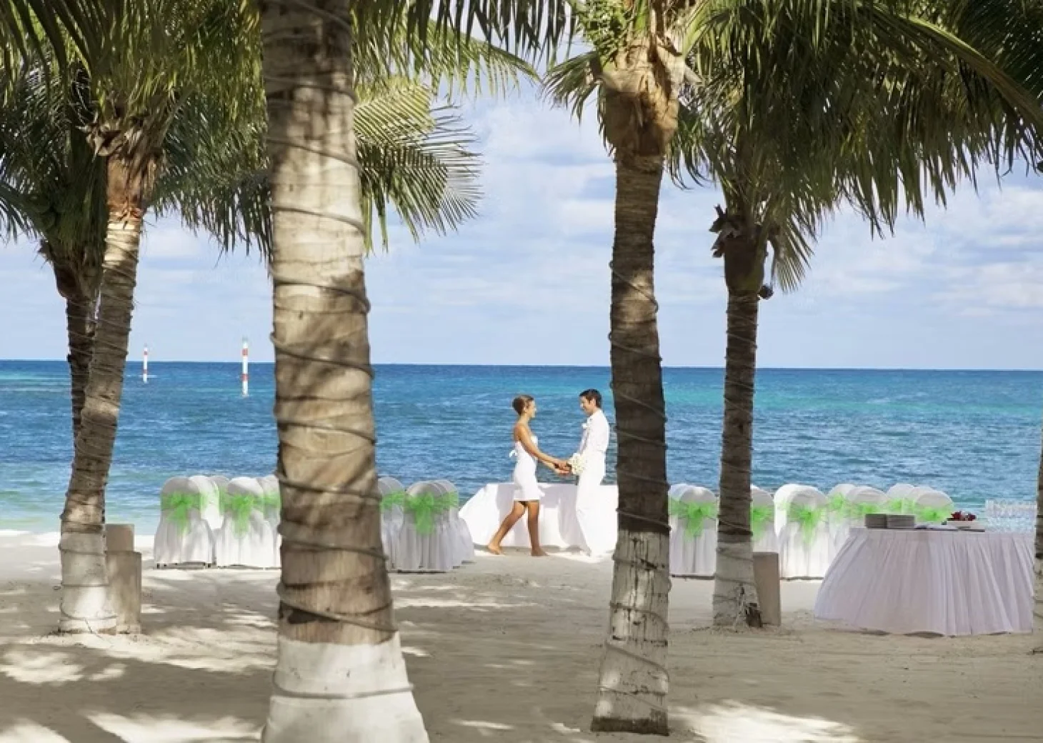 bride and groom on the beach at Occidental Costa Cancun