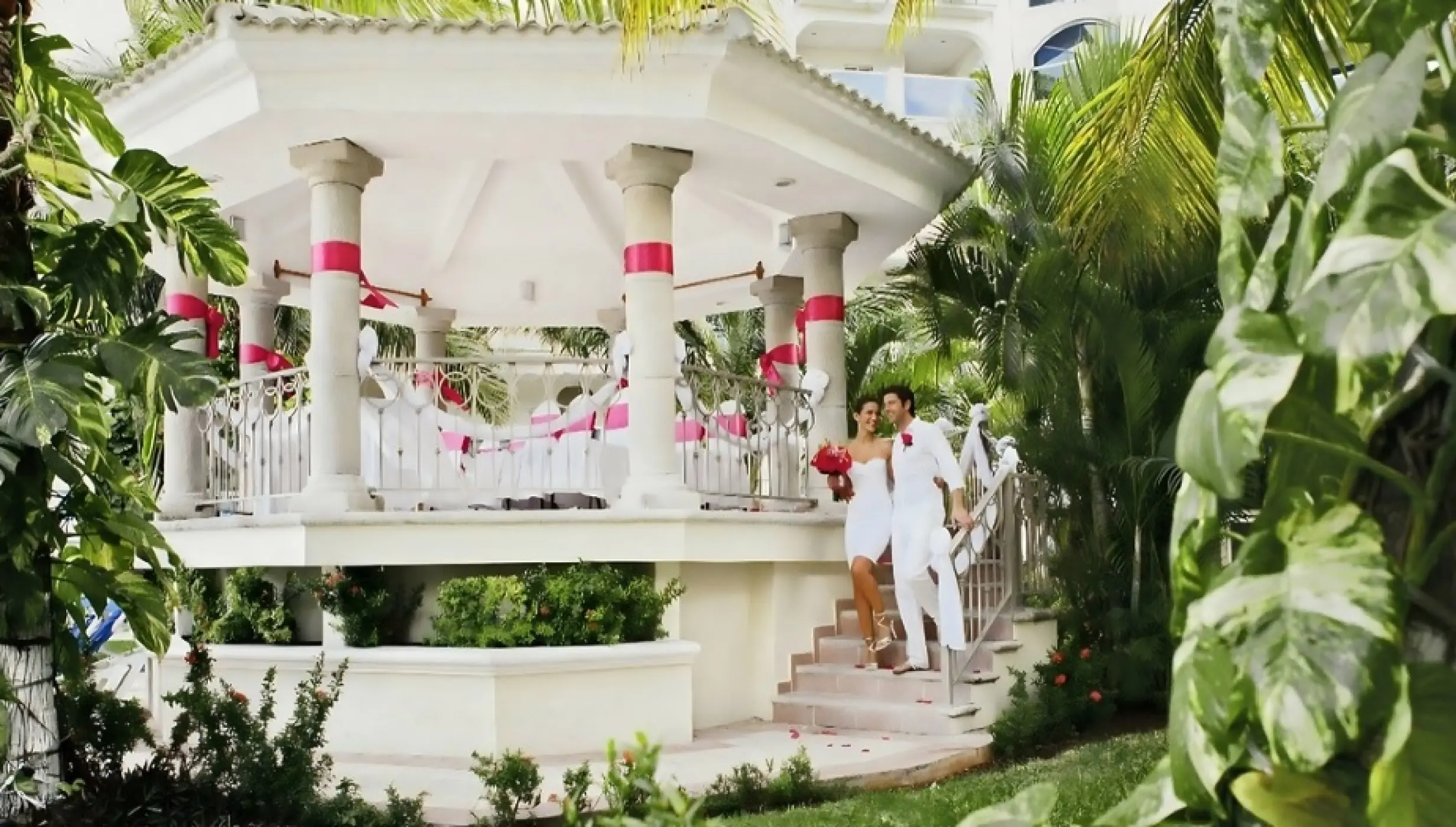 bride and groom at garden gazebo venue at occidental costa cancun