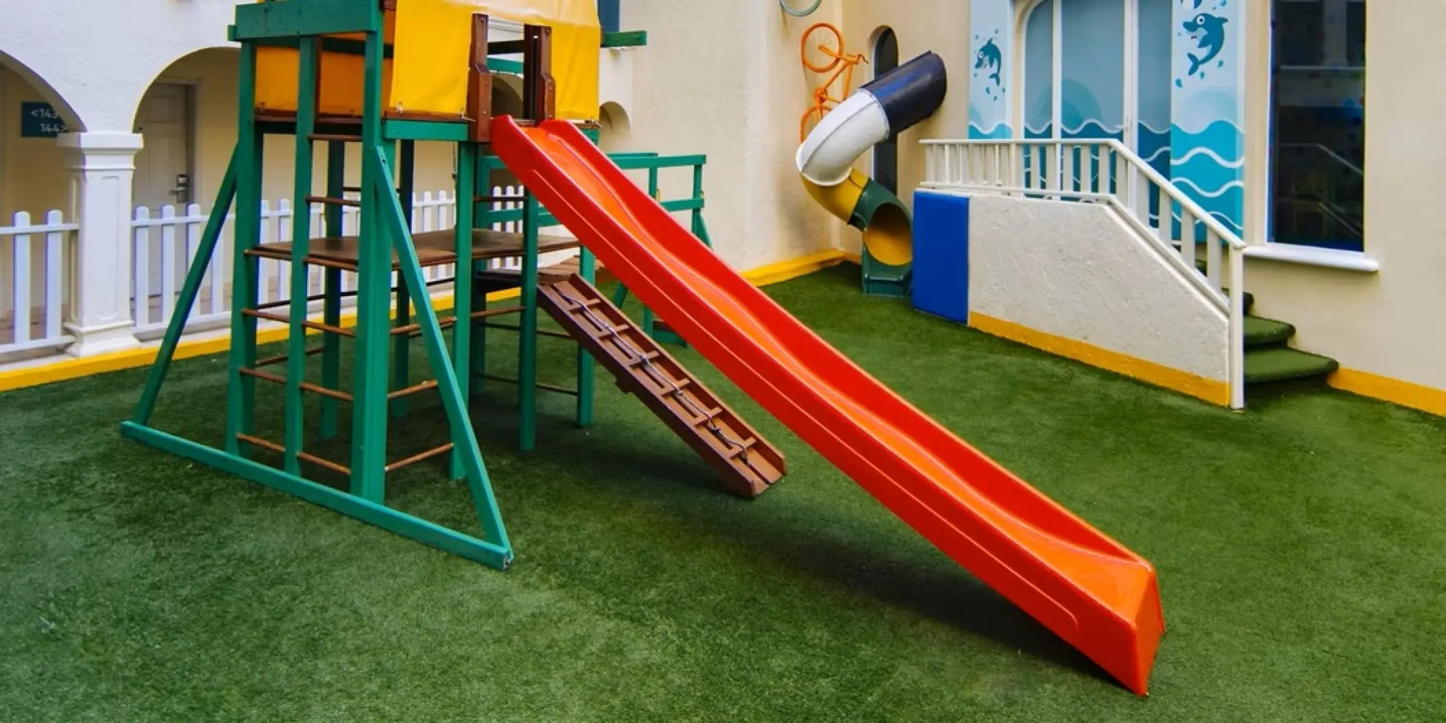 Colorful outdoor kids play area with slides and climbing frames at Occidental Costa Cancun, Cancun