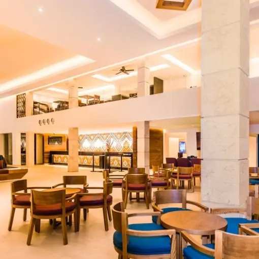 Occidental Costa Cancun lobby with seating areas and stone pillars, Cancun