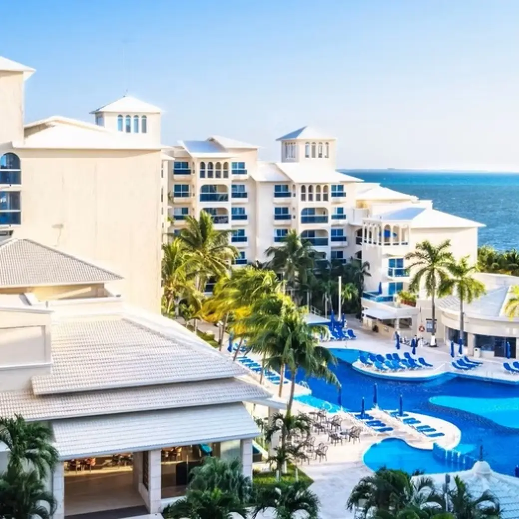 Occidental Costa Cancun swimming pool and resort exterior by the Caribbean Sea, Cancun