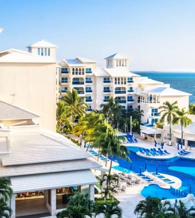 Occidental Costa Cancun swimming pool and resort exterior by the Caribbean Sea, Cancun