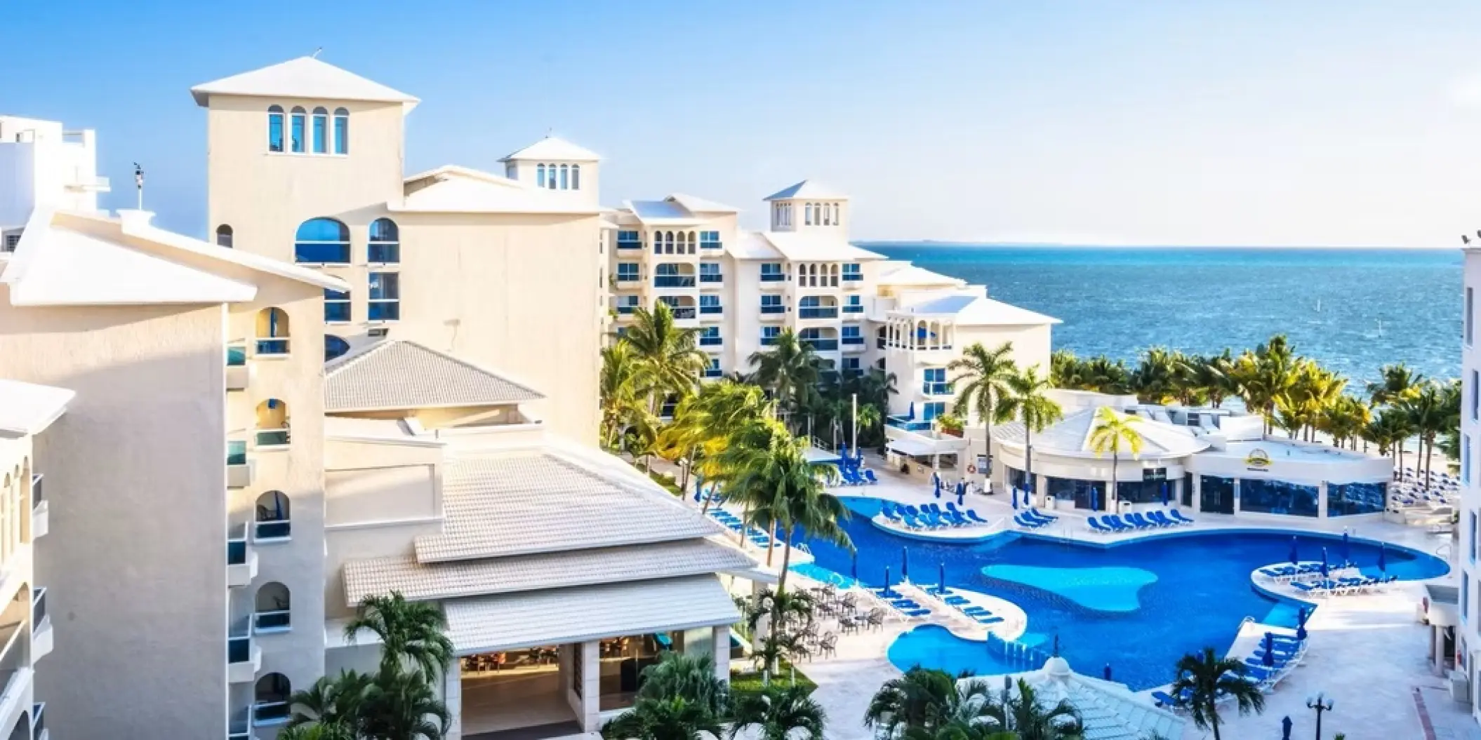 Occidental Costa Cancun swimming pool and resort exterior by the Caribbean Sea, Cancun