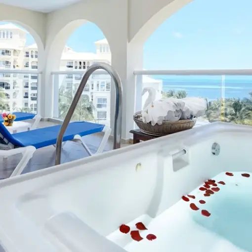 Private terrace with jacuzzi and lounge chairs at Occidental Costa Cancun