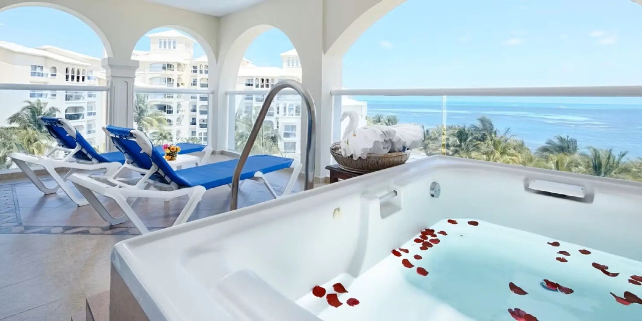Private terrace with jacuzzi and lounge chairs at Occidental Costa Cancun