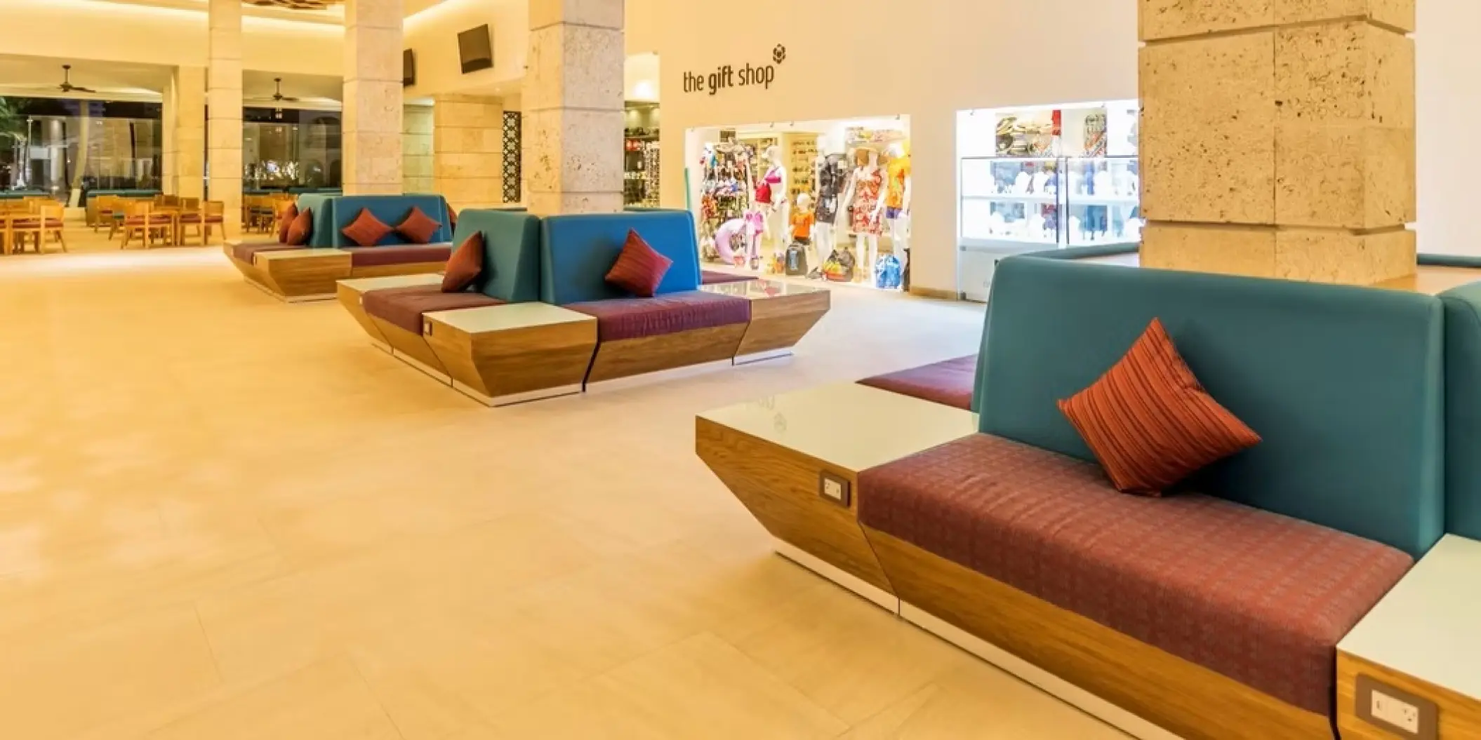 Lobby seating area and gift shop at Occidental Costa Cancun