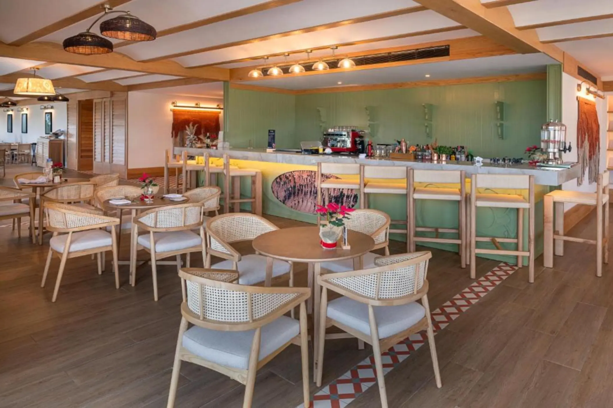 Modern indoor bar and lounge area with light wood furniture at Ocean Allure Costa Mujeres, Cancun