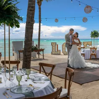 The bride and groom dancing on a beach reception floor at Ocean Allure, Cancun