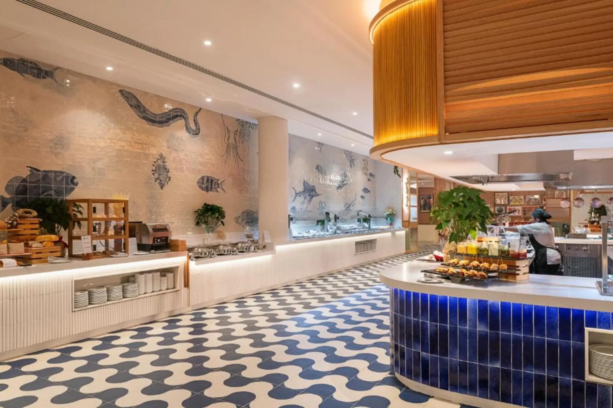 Buffet restaurant with blue tiled floors and nautical wall art at Ocean Allure Costa Mujeres, Cancun