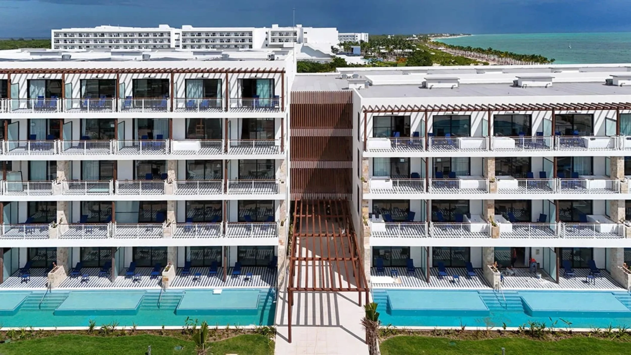 buildings at Ocean Allure Costa Mujeres with balconies and swim out pools visible