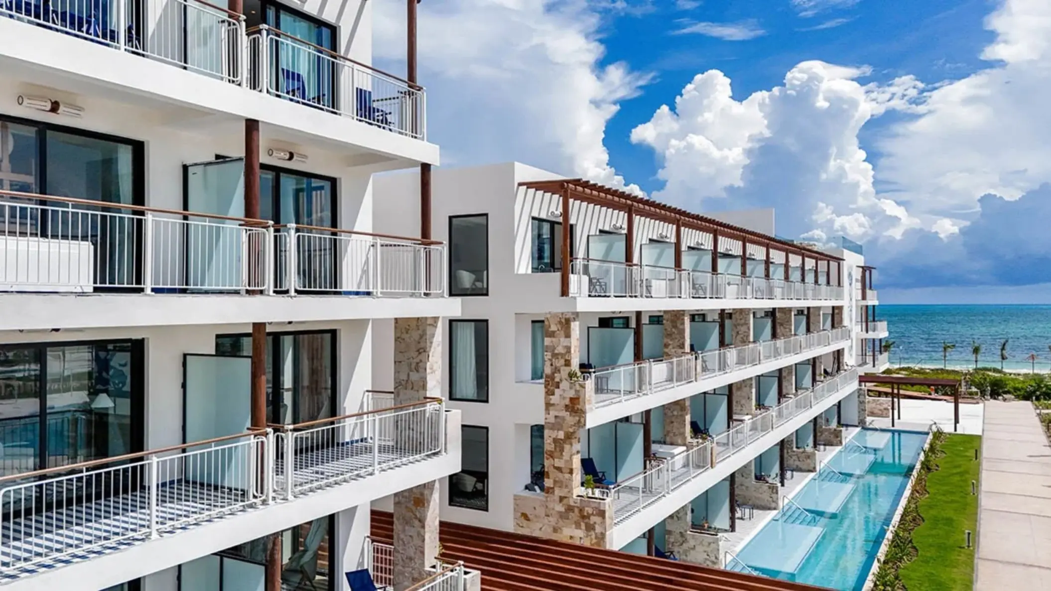 Modern suite balconies and swim-up pools at Ocean Allure Costa Mujeres, Cancun