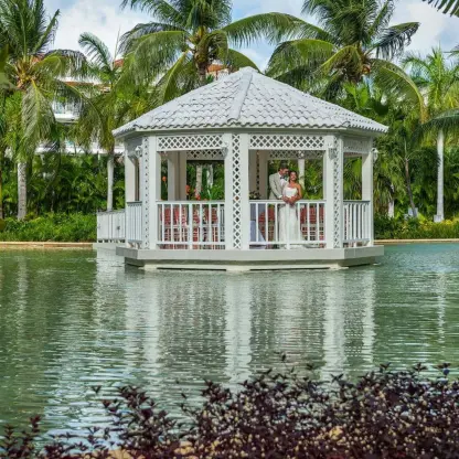 White garden gazebo wedding ceremony venue over the water at Ocean Allure Costa Mujeres, Cancun