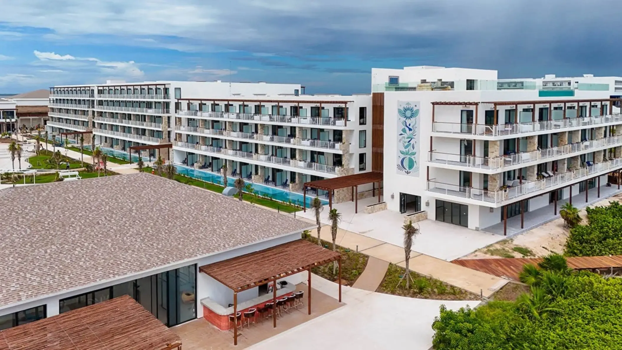 Exterior of the modern beachfront buildings at Ocean Allure Costa Mujeres, Cancun
