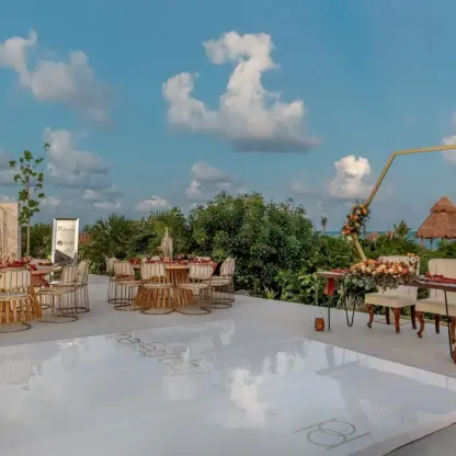 Outdoor wedding reception at Ocean Allure Costa Mujeres with dance floor and floral hexagon arch, Cancun