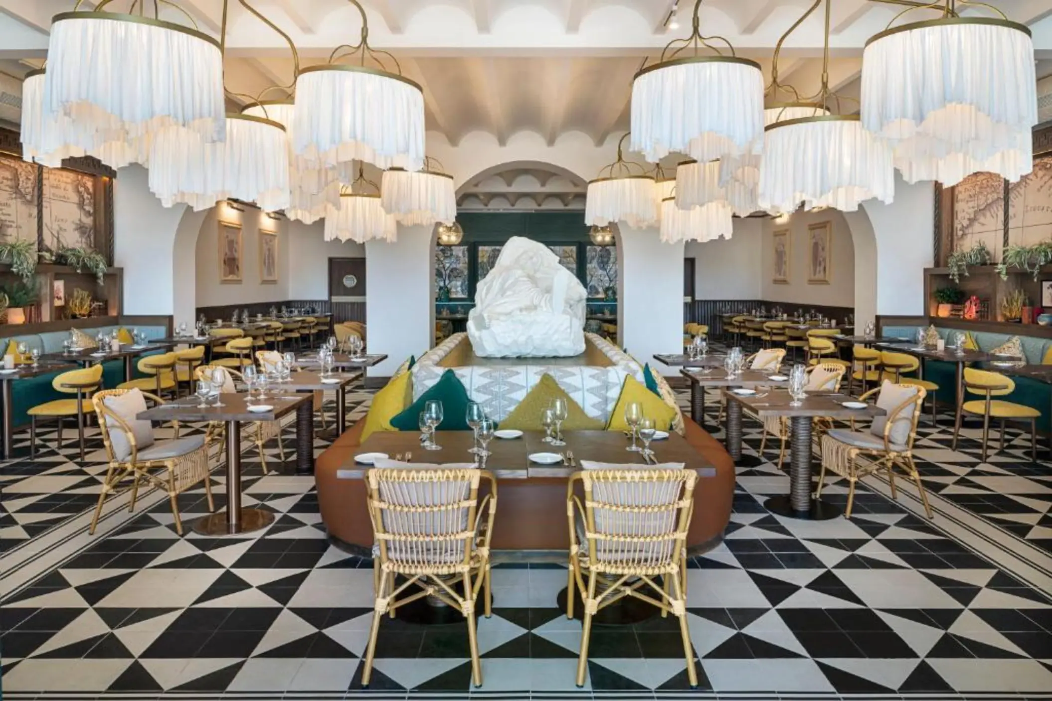 Modern dining room with fringe chandeliers and geometric flooring at Ocean Allure Costa Mujeres, Cancun