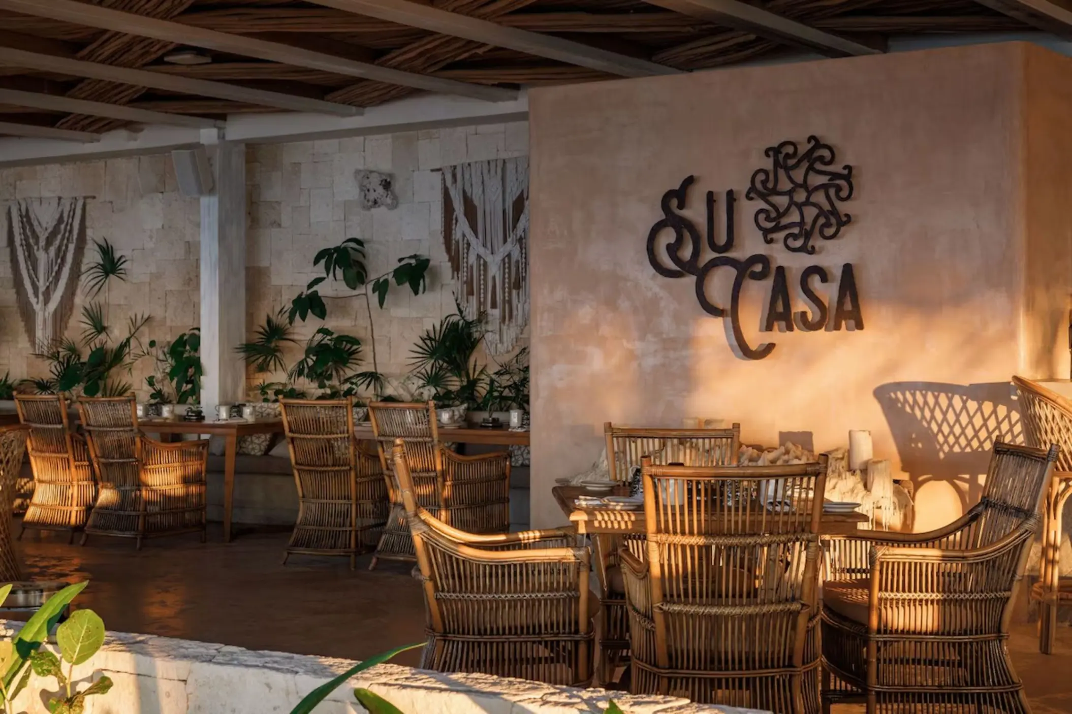 Su Casa restaurant with wicker chairs and bohemian decor at Palmaia - The House of AiA, Playa Del Carmen