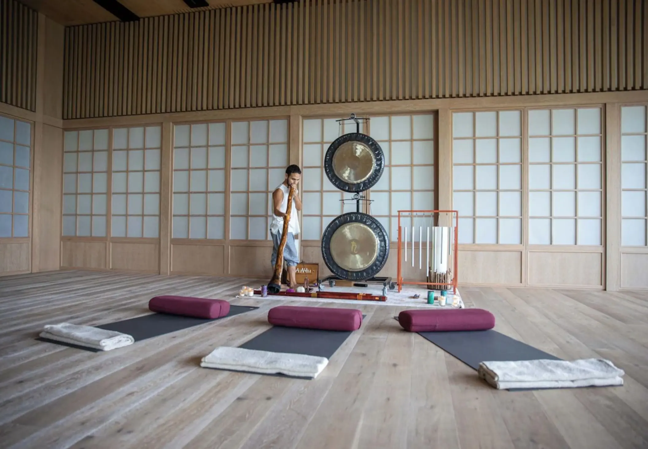 Sound healing session with gongs and yoga mats at Palmaia The House of AiA, Playa Del Carmen