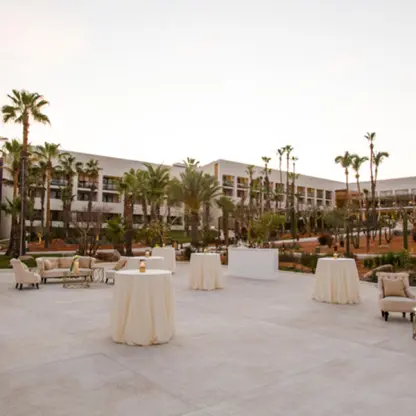 Outdoor cocktail reception setup with white lounge furniture at Paradisus Los Cabos, Cabo San Lucas