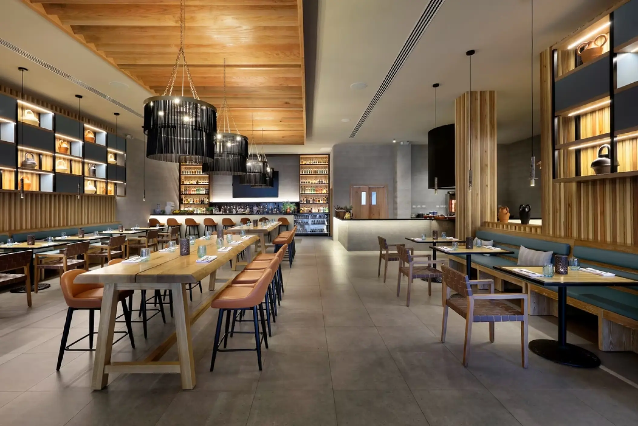 Blue Agave restaurant interior with wooden tables and modern lighting at Paradisus Palma Real, Punta Cana