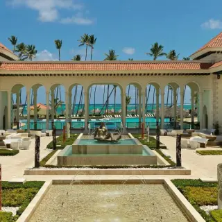 Colonial Plaza courtyard with fountains and arches at Paradisus Palma Real, Punta Cana