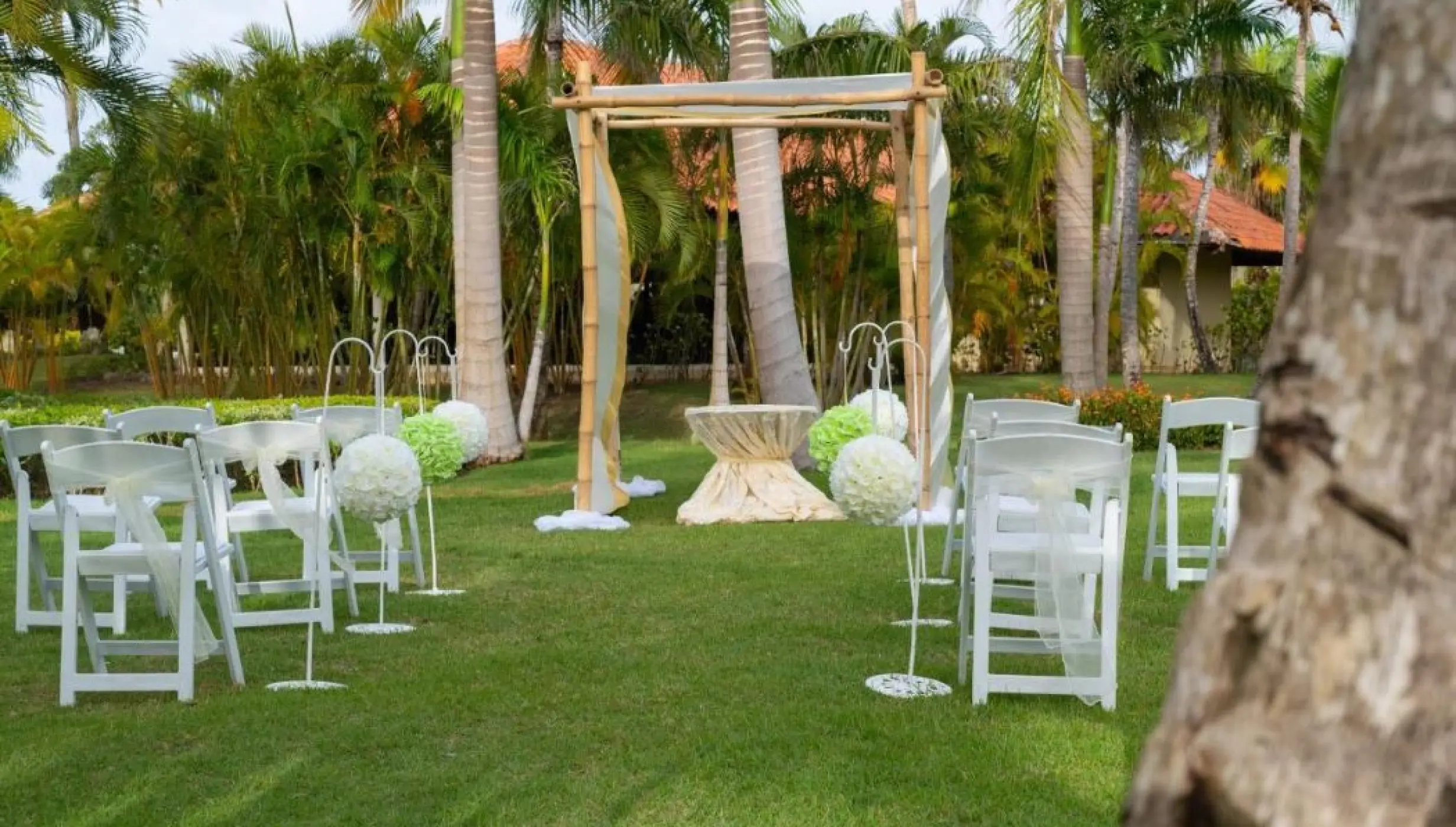 Garden wedding ceremony setup with bamboo huppah at Paradisus Palma Real, Punta Cana