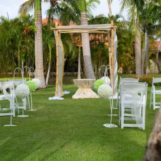 Garden wedding ceremony setup with bamboo huppah at Paradisus Palma Real, Punta Cana