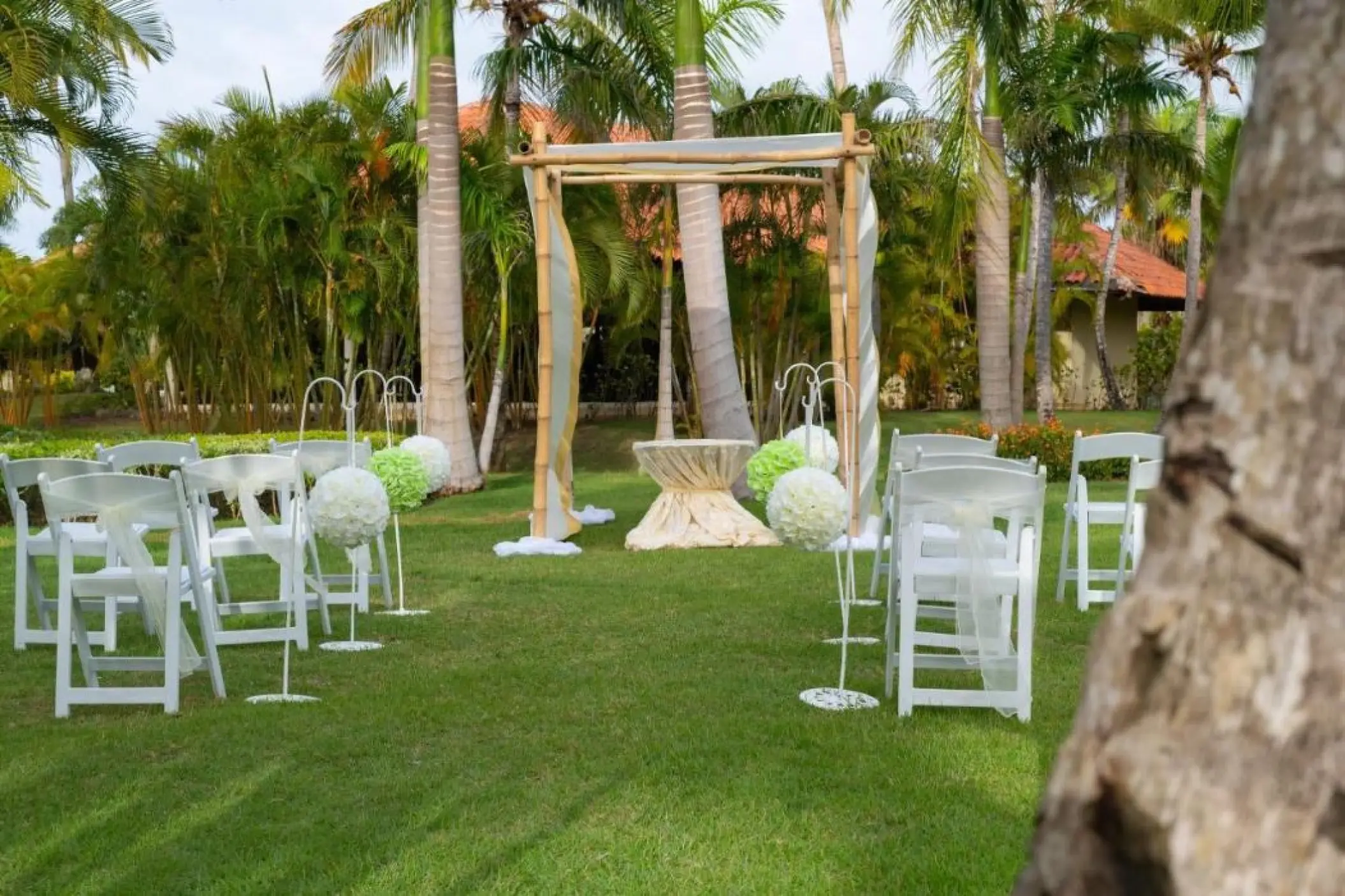 Garden wedding ceremony setup with bamboo huppah at Paradisus Palma Real, Punta Cana