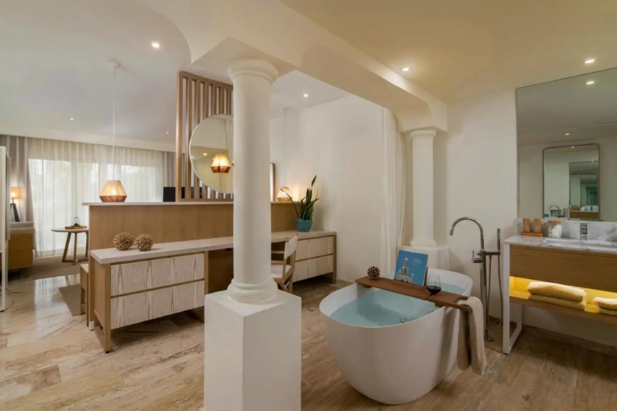 Junior Suite bathroom with a freestanding soaking tub and marble floors at Paradisus Palma Real, Punta Cana