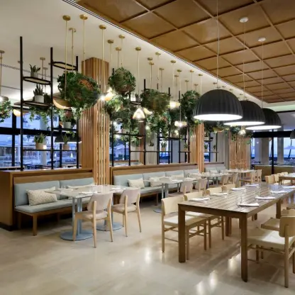 Malva Food Bazaar restaurant interior with hanging plants and dome lighting at Paradisus Palma Real, Punta Cana