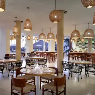 Malva Terrace restaurant venue with hanging woven light fixtures at Paradisus Palma Real, Punta Cana