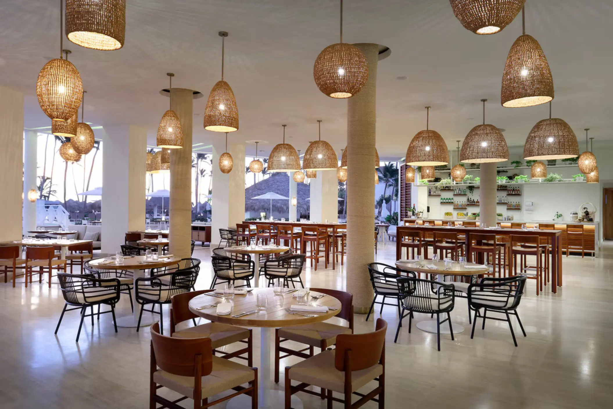 Malva Terrace restaurant venue with hanging woven light fixtures at Paradisus Palma Real, Punta Cana